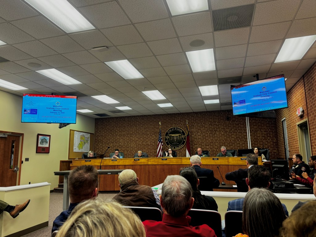The City of Graham council chambers as seen from the public seating area.