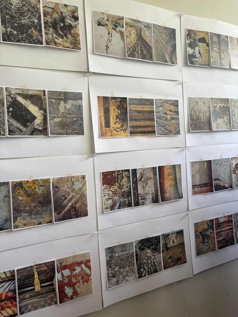 Photos are pinned to artist Lauren Rutten's wall. You can see the image that inspired her to call the project, Save This Piece. 